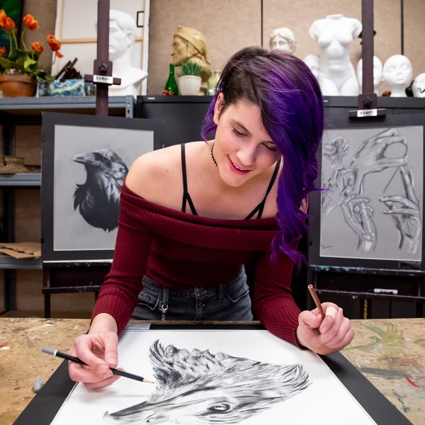 Fine Arts student finishes a drawing of a bird.