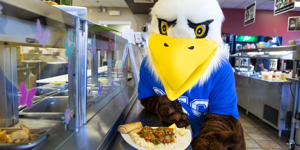 Ozzy showing off food in Cafe 101.