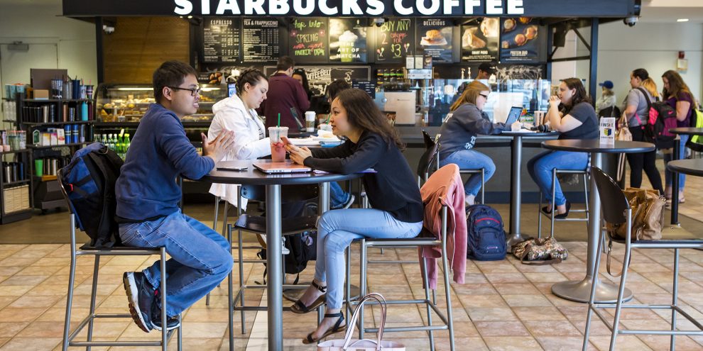 Students sitting at Starbucks.