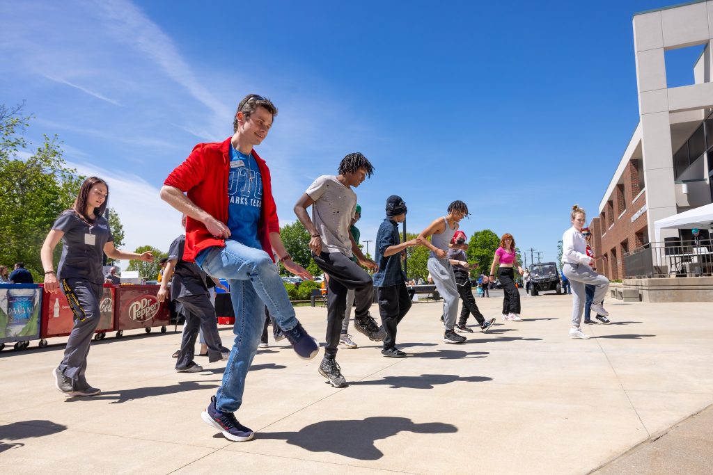 Students dancing at picnic