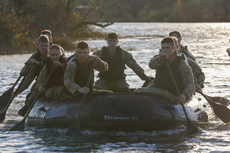 Cadets from Missouri State University complete the zodiac race, the last event Cadets competed in for the 3rd Brigade Army ROTC Ranger Challenge, Nov. 5, at Fort Leonard Wood, Mo. Four nine-man teams raced to load a dummy into a zodiac, row it across a lake and then back to the start point. | Photo by Amy Turner, U.S. Army Cadet Command Public Affairs